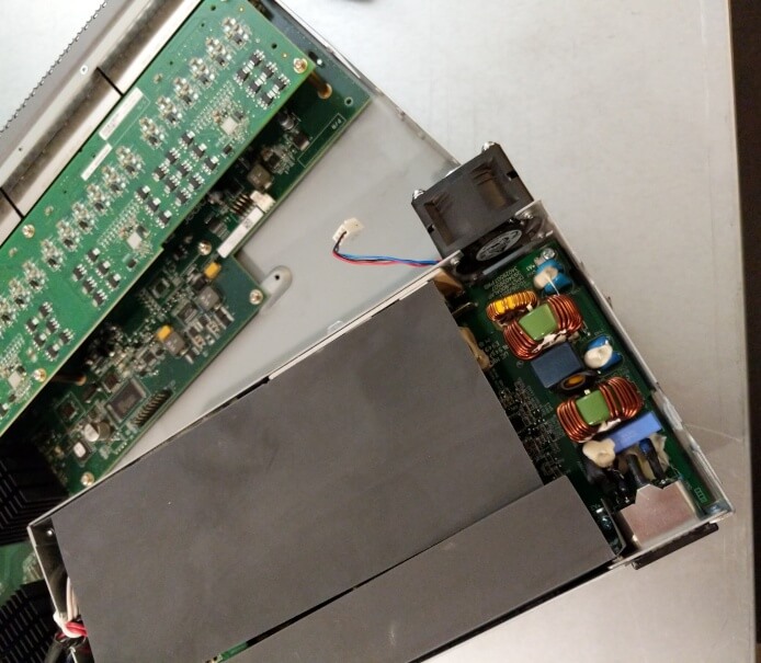 power supply module lifted and swung out at an angle